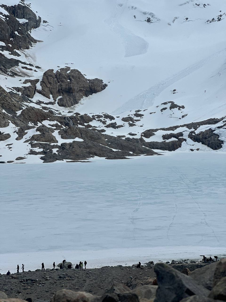 Laguna de los Tres, Patagonia — frozen lake beneath snow-covered mountains